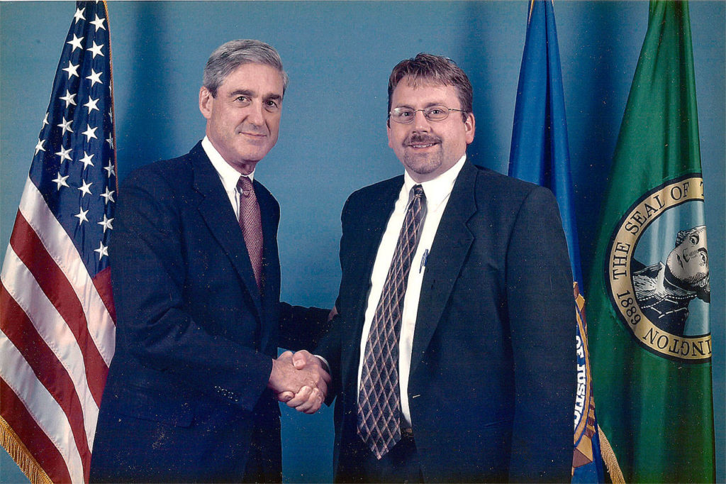 This 2005 photo shows then FBI Director Robert Mueller (left)	with Alan Hardwick when he came to the bureau’s Seattle field office. Hardwick was assigned as lead investigator to the FBI through the Joint Terrorism Task Force with members from state and local law enforcement. (Courtesy photo)
