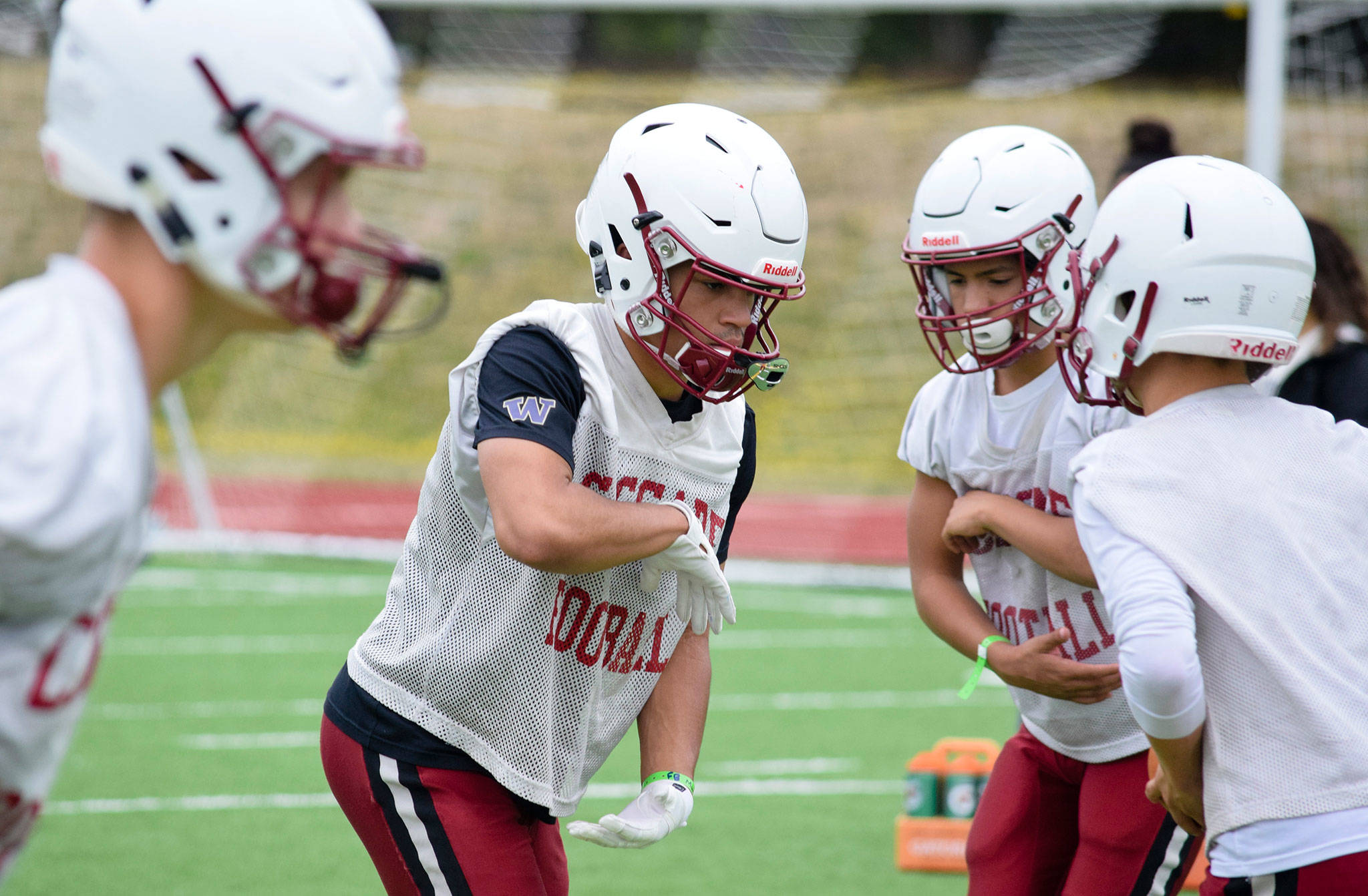 Senior running back Davanta Murphy-McMillian practices hand-offs at Cascade High School on Wednesday, Aug. 21. (Katie Webber / The Herald)