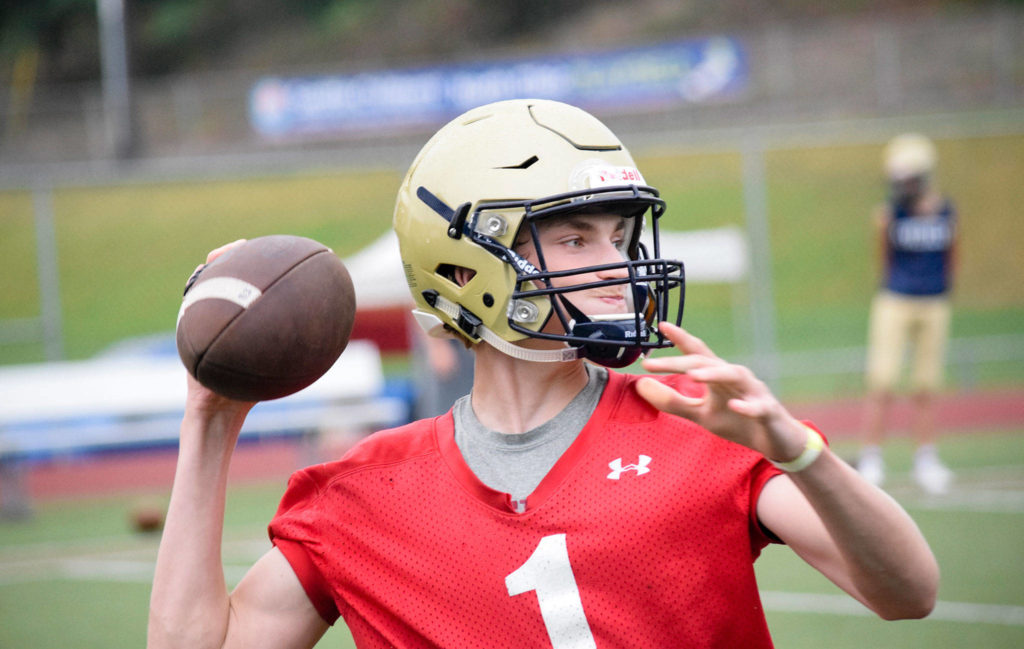 Everett quarterback Casen Taggart throws to a reciever at Everett Memorial Stadium on Wednesday, Aug. 21. (Katie Webber / The Herald)
