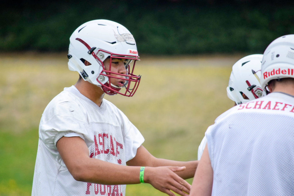 Junior Miles Fabre talks to his teammates during defense drills at Cascade High School on Wednesday, Aug. 21. (Katie Webber / The Herald)
