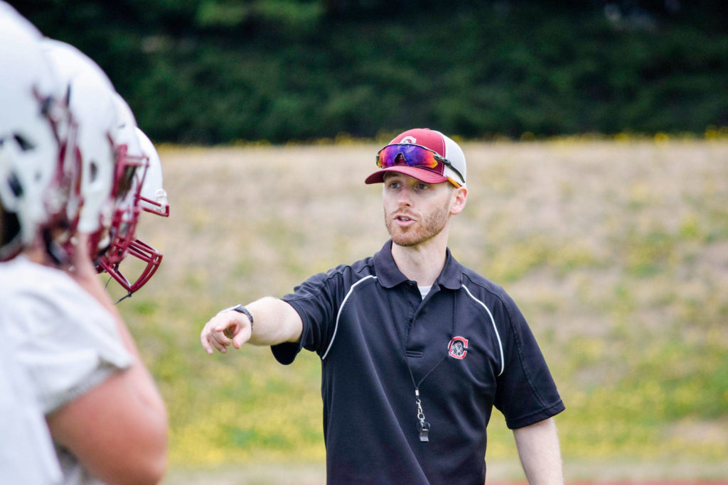 Cascade head coach Jordan Sieh talks to his players between drills at Cascade High School on Wednesday, Aug. 21. (Katie Webber / The Herald)
