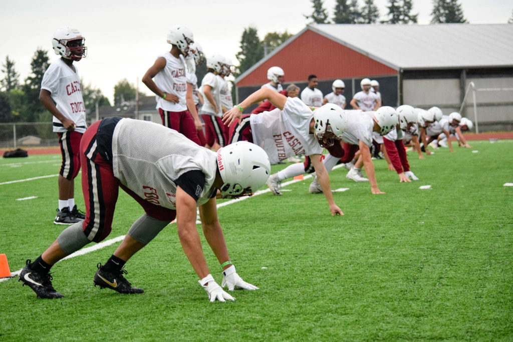 Senior running back Davanta Murphy-McMillian (left) gets set for a kickoff drill at Cascade High School on Wednesday, Aug. 21. (Katie Webber / The Herald)
