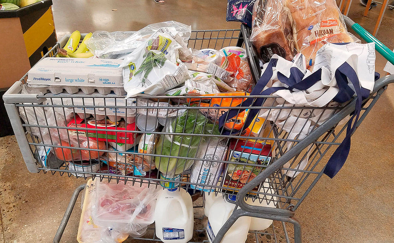 Shopping from the USDA’s MyPlate sample grocery list is trickier than it sounds, especially when the four gallons of milk fall out of the cart. (Jennifer Bardsley)