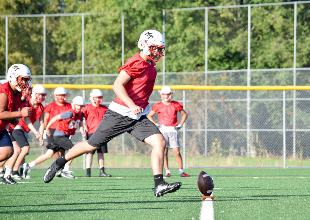 Senior Noah Thompson practices kick-offs at Mountlake Terrace High School on Thursday, Aug. 22. (Katie Webber / The Herald)
