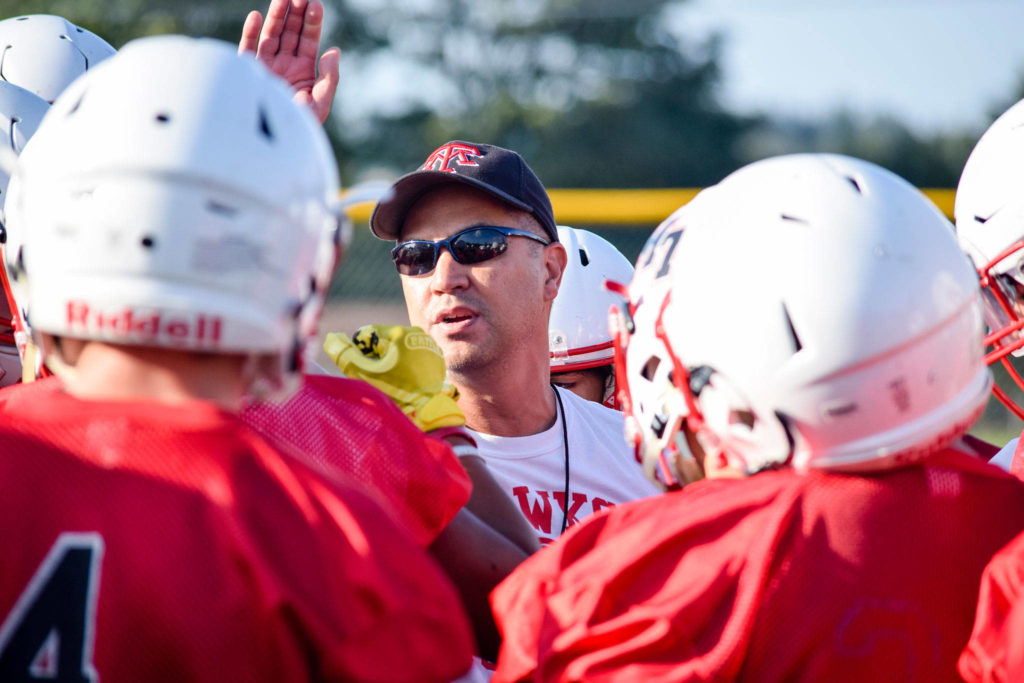 Mountlake Terrace’s head coach Tony Umayam talks to his players in-between drills at practice on Thursday, Aug. 22. (Katie Webber / The Herald)
