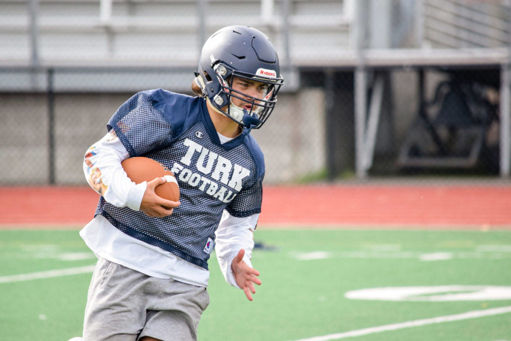 Sultan junior Zane Sailor runs with the ball during practice on Aug. 23, 2019, at Sultan High School. (Katie Webber / The Herald)
