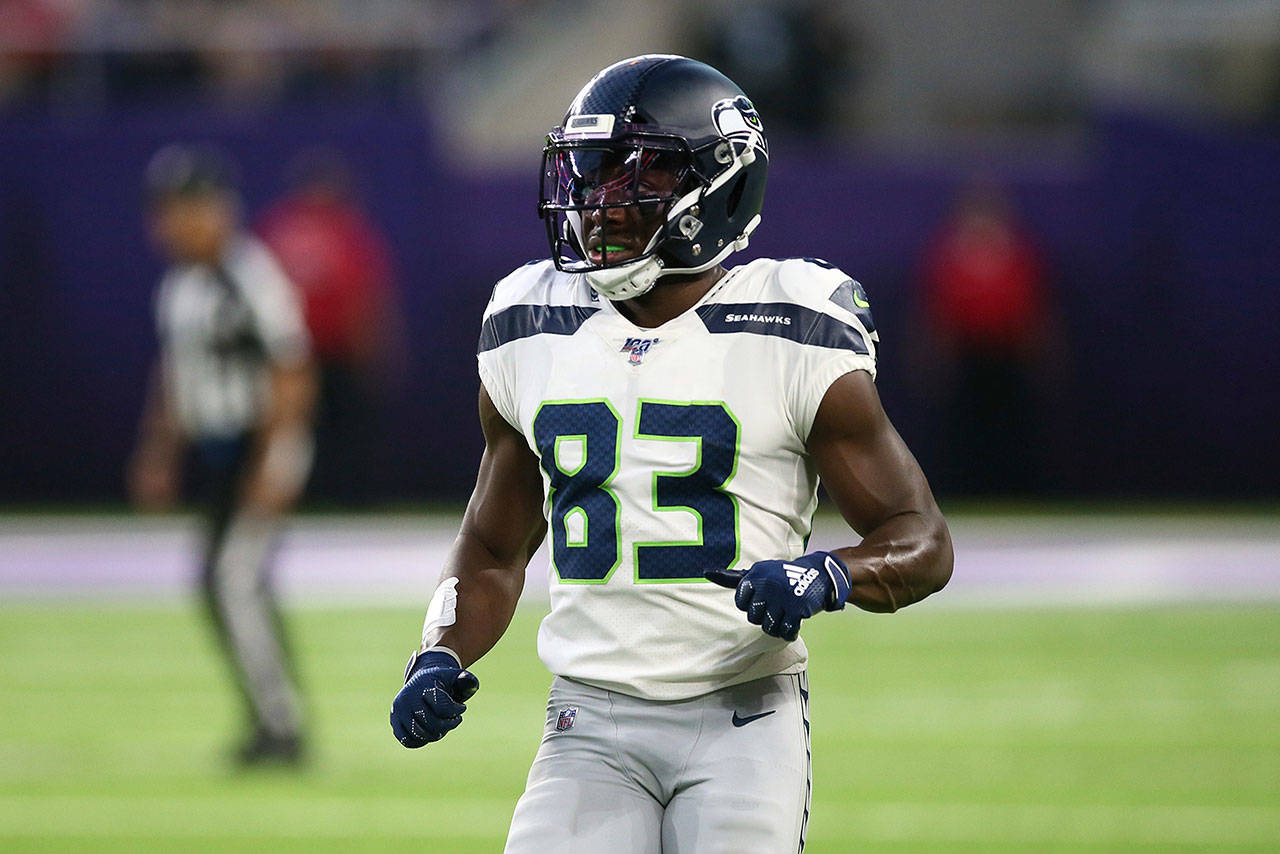 Seattle Seahawks wide receiver David Moore runs on the field during the first half of a preseason game against the Minnesota Vikings, Sunday, Aug. 18, 2019, in Minneapolis. (AP Photo/Jim Mone)
