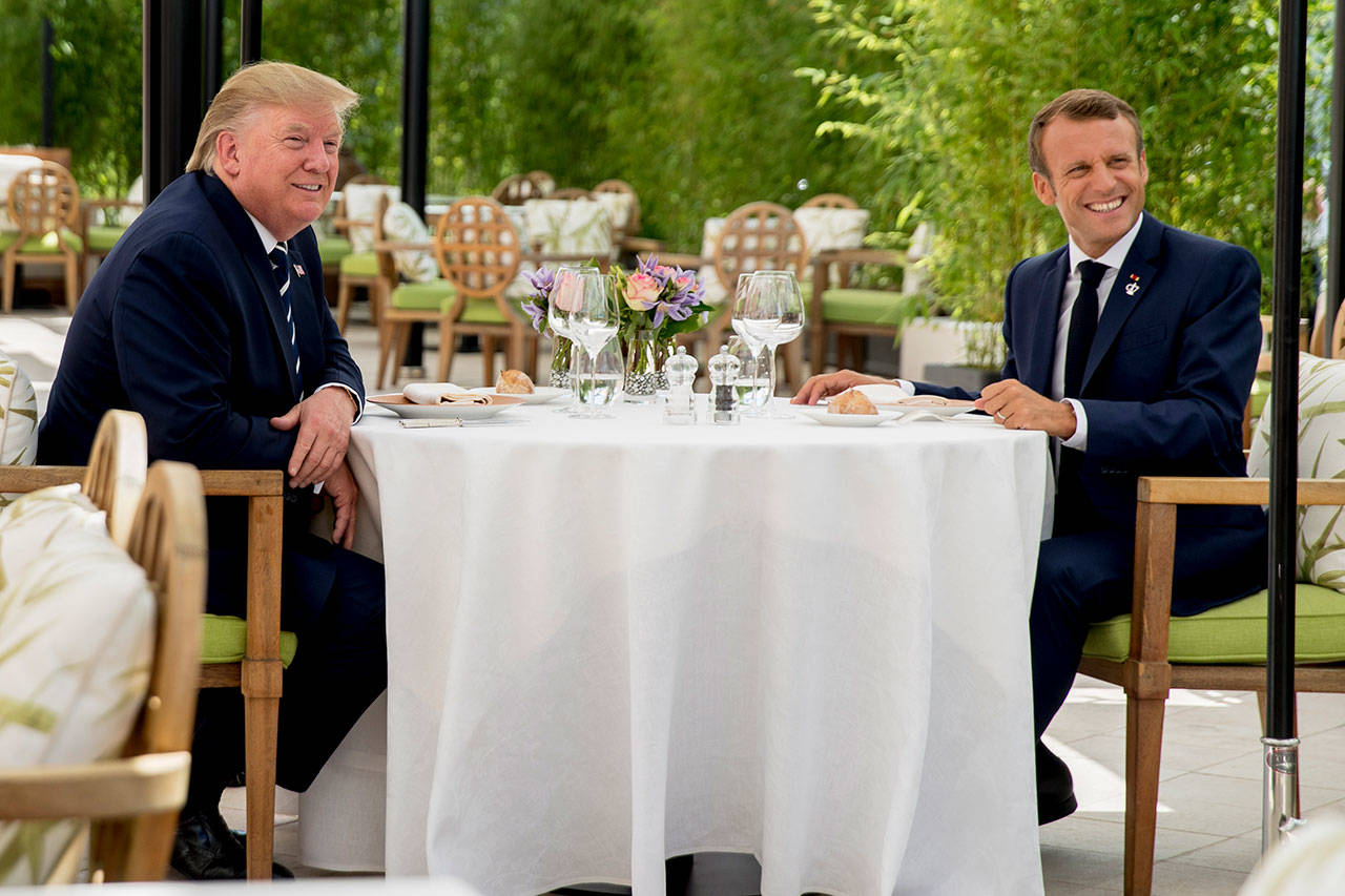 President Donald Trump sits for lunch with French President Emmanuel Macron at the Hotel du Palais in Biarritz, south-west France on Saturday. (AP Photo/Andrew Harnik)