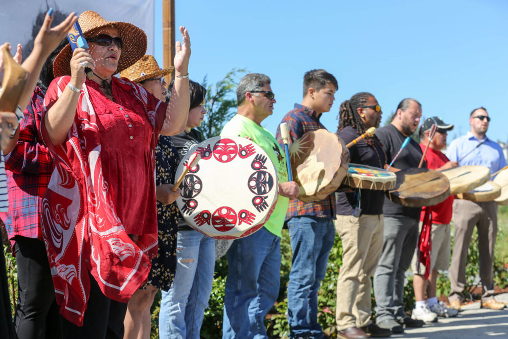 Tulalip tribal members open the naming ceremony of the Pilchuck Julia Landing in song Tuesday afternoon in Snohomish. (Kevin Clark / The Herald)
