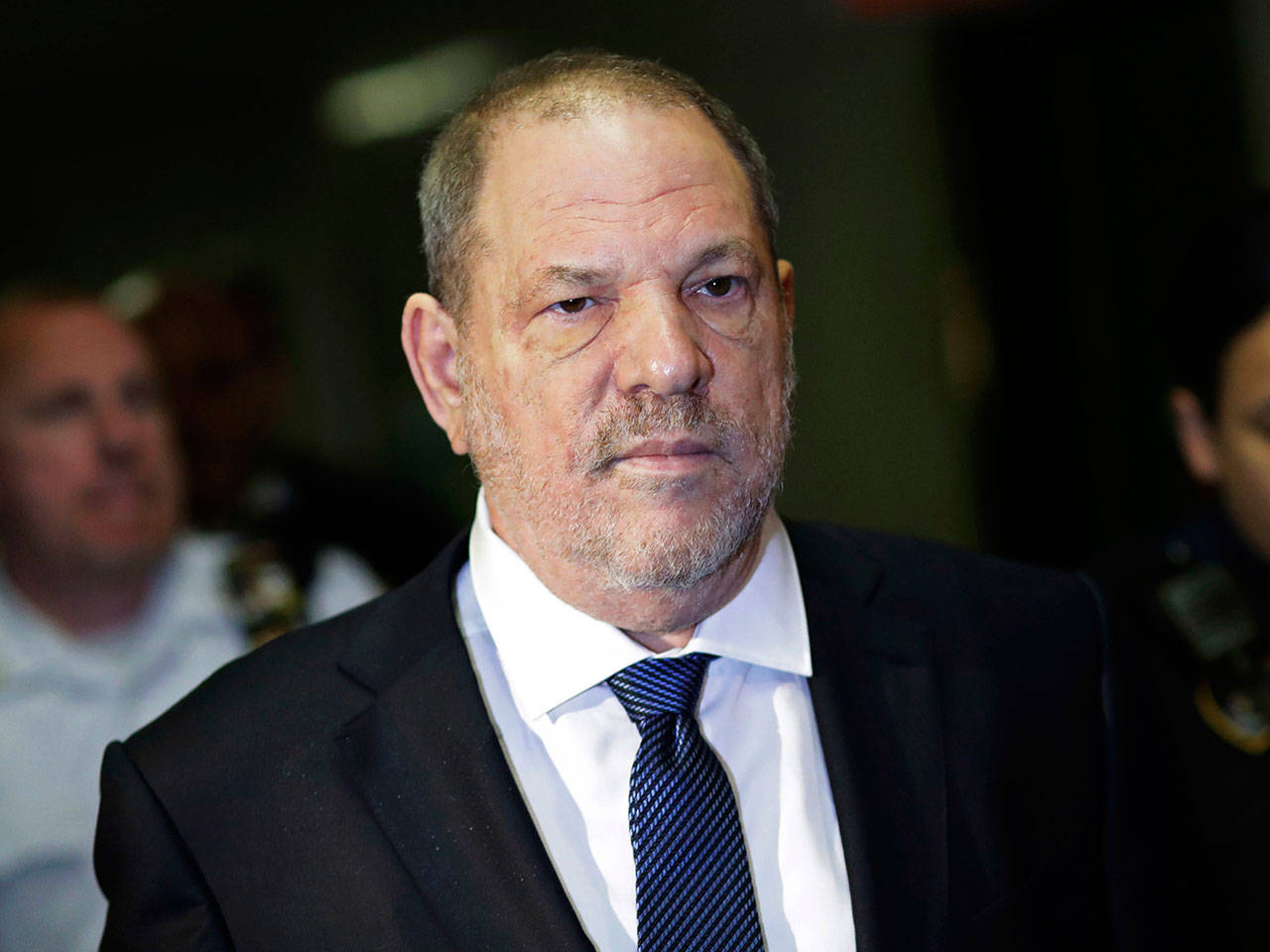 Harvey Weinstein enters State Supreme Court in New York on Oct. 11. Weinstein’s lawyers want the trial over the sexual assault case against the disgraced movie mogul moved from New York City to Long Island or upstate New York because of a blizzard of pretrial publicity. An appeals court could rule on the request as early as Monday. (AP Photo/Mark Lennihan, File)