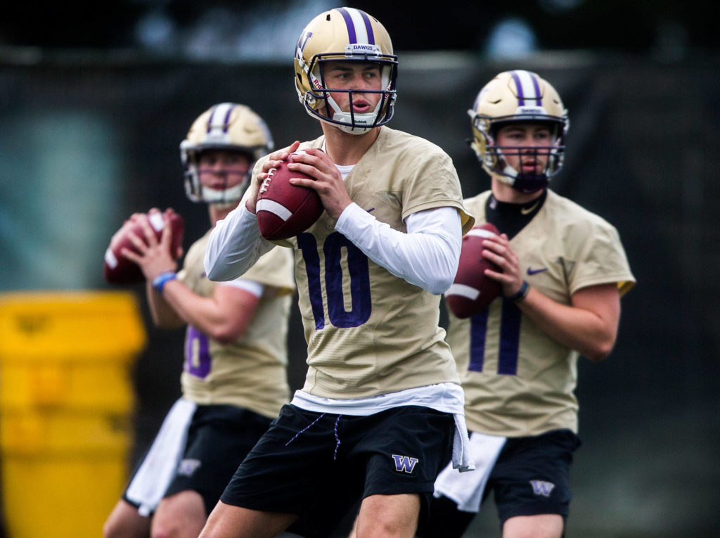 UW’s Jacob Eason runs through drills during football practice at the University of Washington on April 3 in Seattle. (Olivia Vanni / Herald file)

