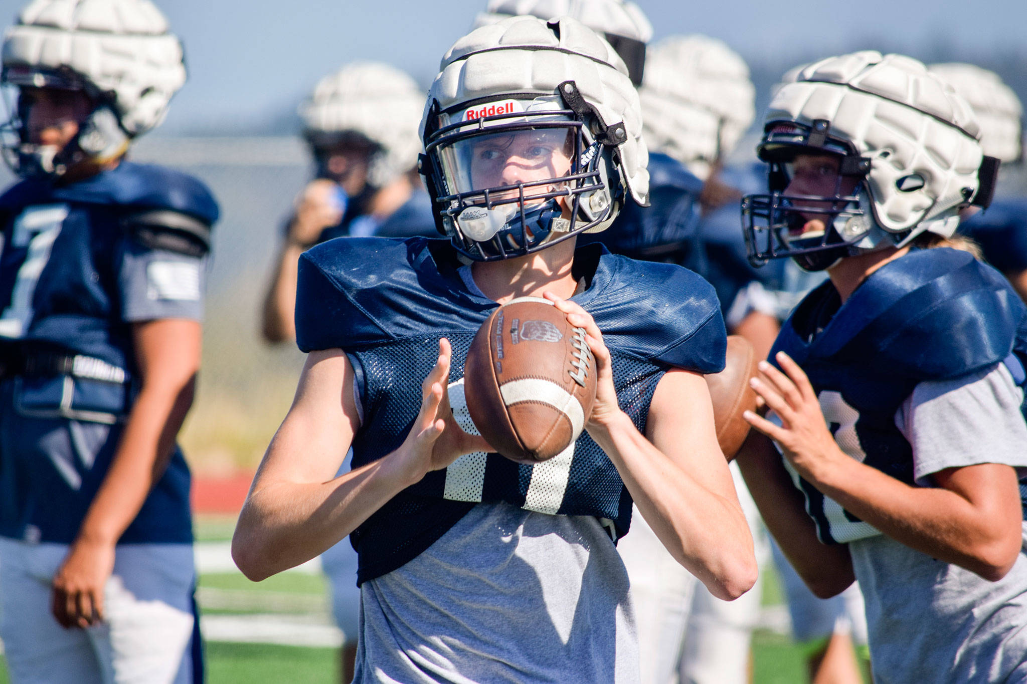 Sophomore Jadon Claps prepares to throw to a receiver during football practice on Aug. 27, 2019, at Glacier Peak High School in Snohomish. (Katie Webber / The Herald)