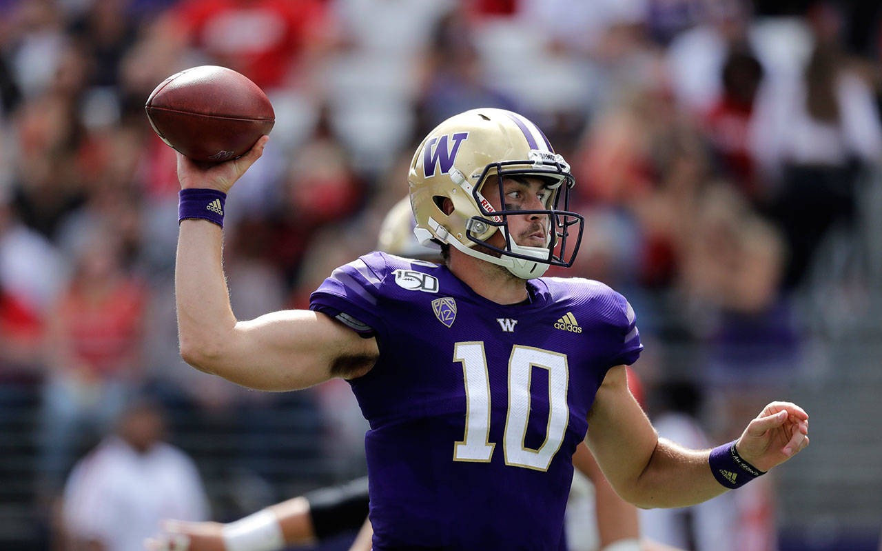 Washington quarterback Jacob Eason passes against Eastern Washington in the first half of a game on Aug. 31, 2019, in Seattle. (AP Photo/Elaine Thompson)