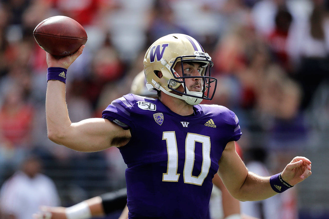 Eason tosses 4 TDs in debut, UW rolls past EWU