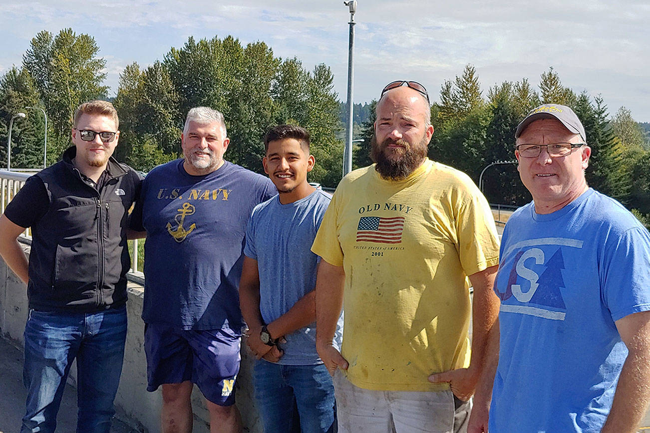 The five area men that Bothell police said saved a man attempting to jump off Highway 527 on Saturday morning. (Bothell Police Department)