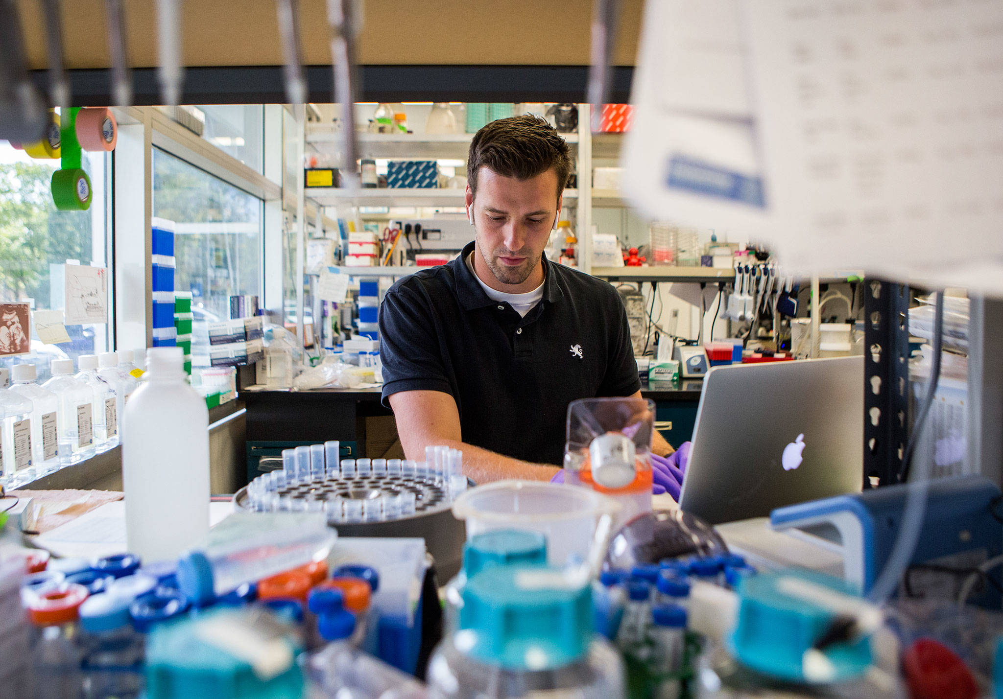 David Jurchen, an employee of Alder Biopharmaceuticals for eight years, works in the proteins lab in Bothell. (Olivia Vanni / The Herald)