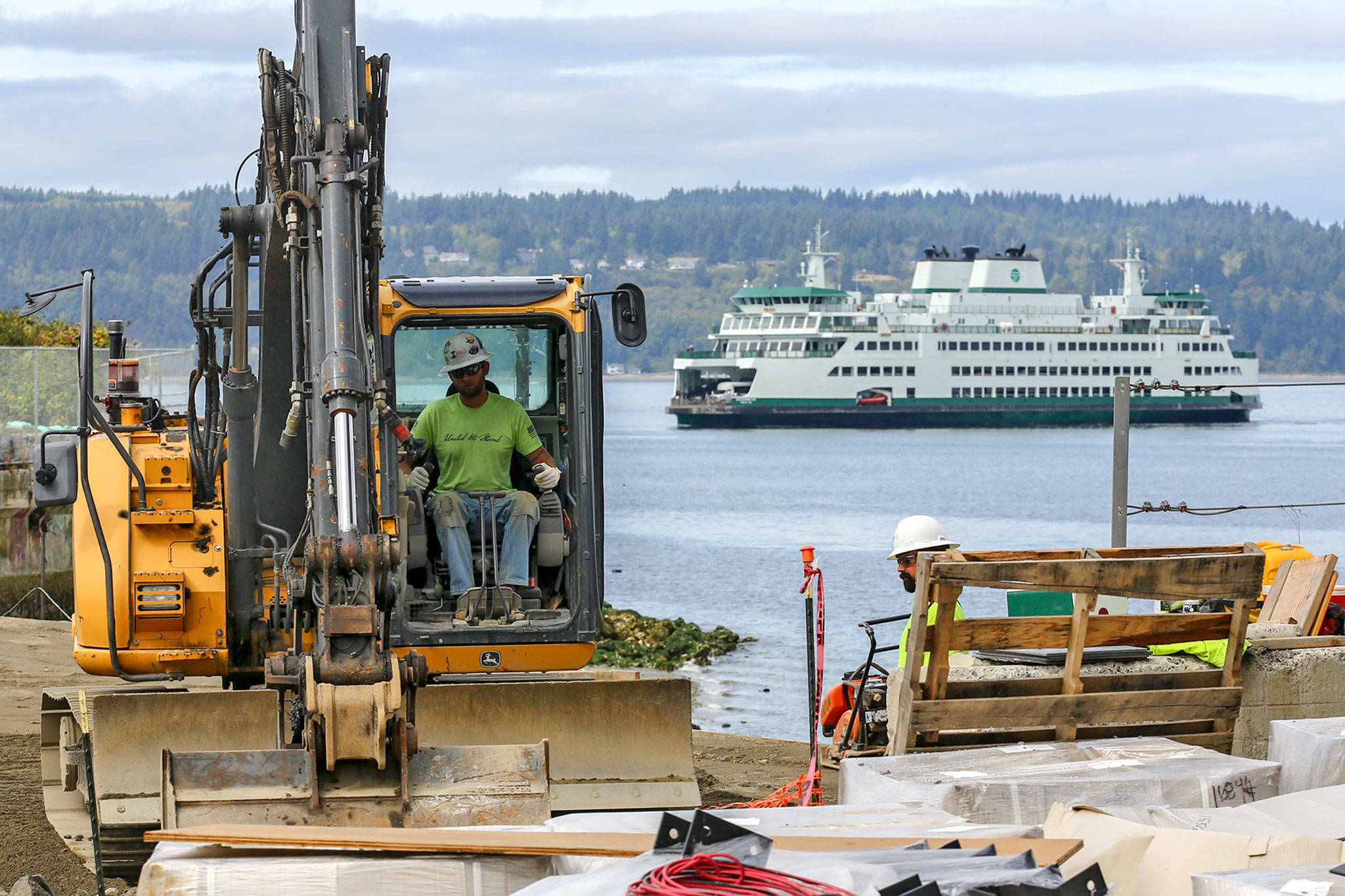 The new seawall                                A construction worker in heavy equipment excavates on the site of the new Mukilteo ferry terminal. (Kevin Clark / The Herald)