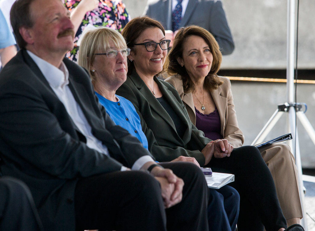 From left, Snohomish County Executive Dave Somers, U.S. Sen. Patty Murray, U.S. Rep. Suzan DelBene and U.S. Sen. Maria Cantwell during speeches at the Lynnwood Link light-rail extension groundbreaking on Tuesday. (Olivia Vanni / The Herald)
