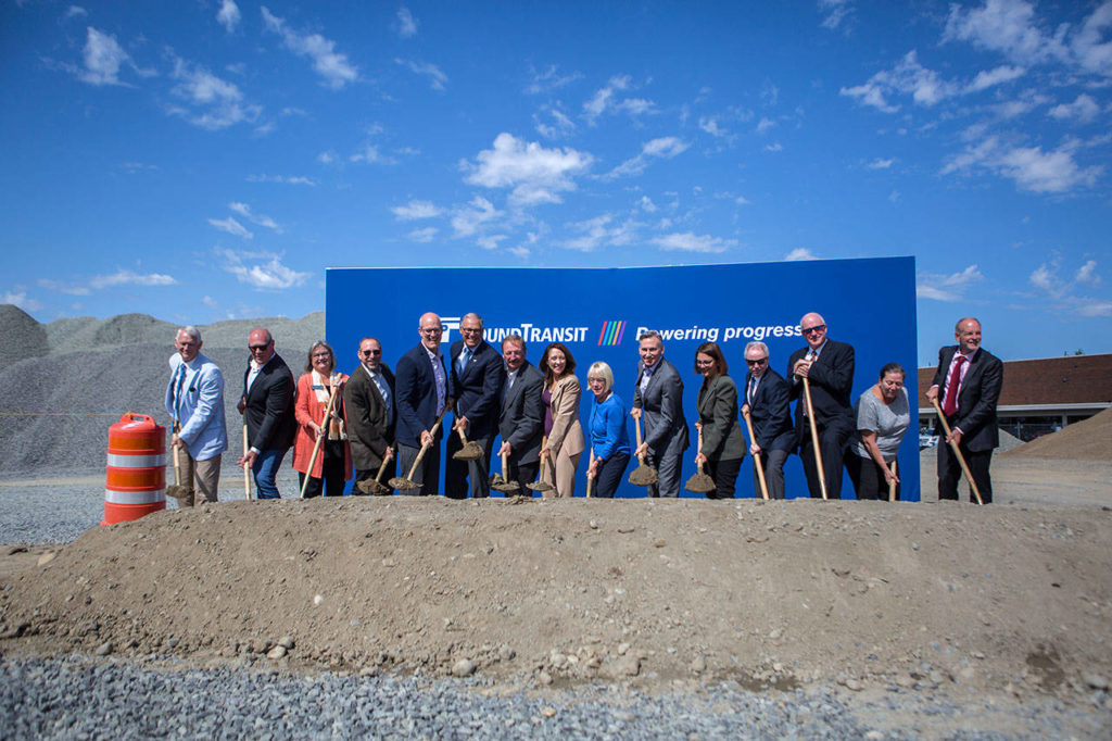 State, county and transit officials line up at the groundbreaking ceremony for the Link light-rail extension on Tuesday in Lynnwood. (Olivia Vanni / The Herald) 
