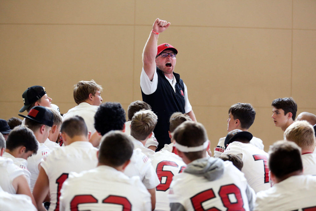 Joey Hammer, head coach, rallies the Panthers after a walk-through in the auxiliary gym at Snohomish High School before the Aug. 30 jamboree at Lake Stevens High School. (Kevin Clark / The Herald)
