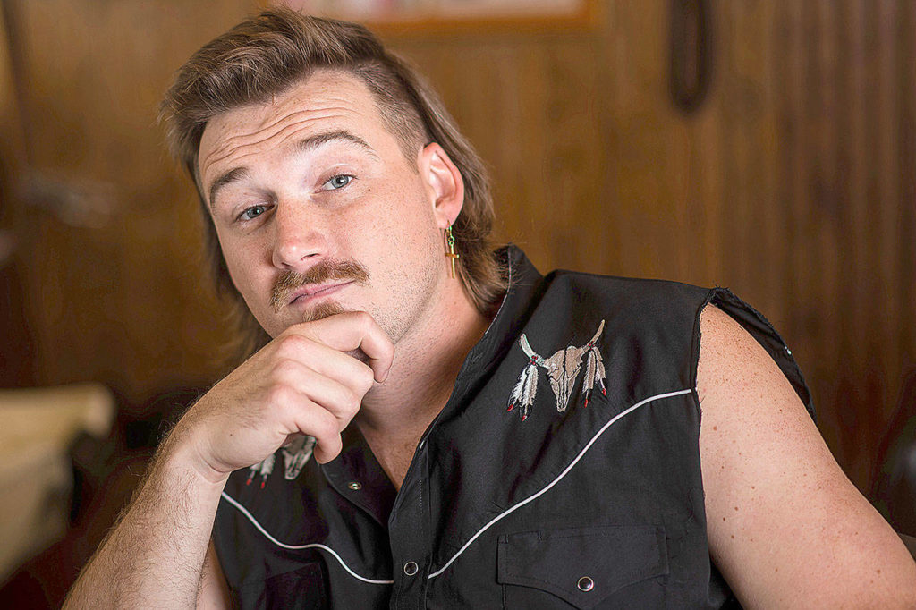 Country singer Morgan Wallen poses for a portrait after getting a mullet at Paul Mole Barber Shop in New York. Wallen, who has turned heads with his likable hit song “Whiskey Glasses,” said he decided to try a mullet after seeing old photos of his dad proudly rocking the hairstyle. (Photo by Charles Sykes/Invision)
