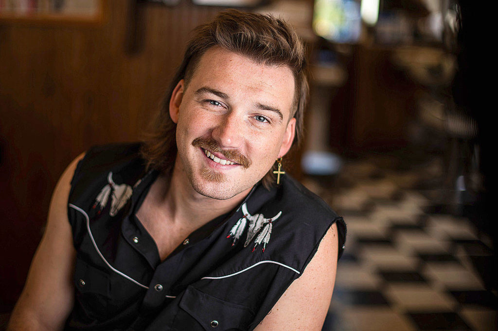 Country singer Morgan Wallen poses for a portrait after getting a mullet at Paul Mole Barber Shop in New York. Wallen, who has turned heads with his likable hit song “Whiskey Glasses,” said he decided to try a mullet after seeing old photos of his dad proudly rocking the hairstyle. (Photo by Charles Sykes/Invision)
