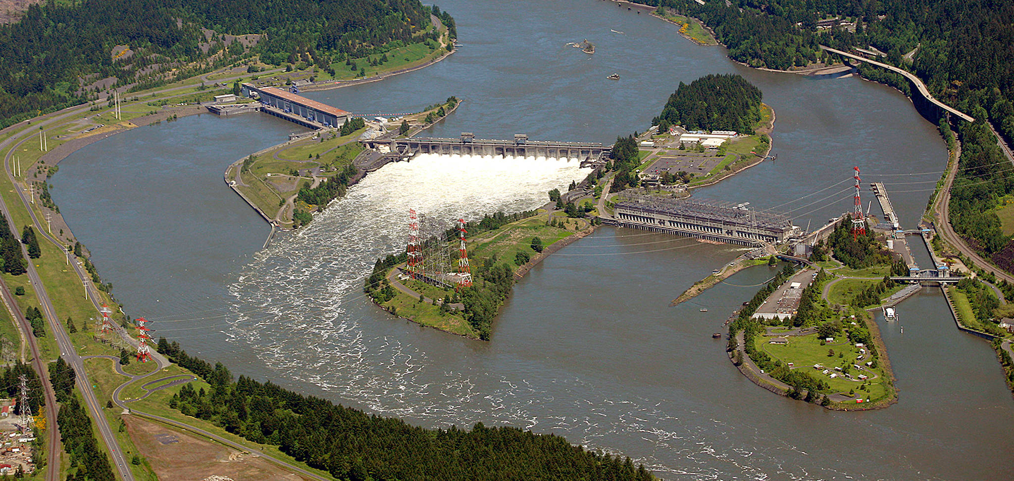 Shown in June 2011, the Bonneville Dam on the Columbia River near Cascade Locks, Oregon, was built in 1938. The Bonneville Power Administration, which provides electricity from this and other dams in the Northwest, is working with the Snohomish PUD to deliver 100 percent renewable energy to power customers. (Rick Bowmer/Associated Press file)
