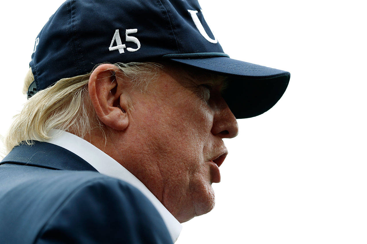 President Donald Trump speaks to the media as he returns Sunday to the White House from Camp David. (AP Photo/Jacquelyn Martin)
