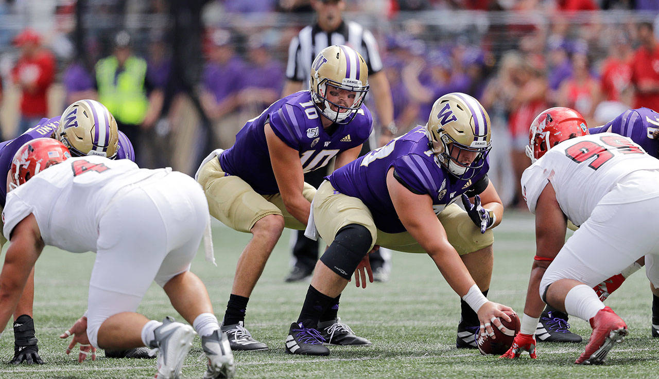 Washington’s Matteo Mele (foreground) replaced Nick Harris at center during the Huskies’ win over Eastern Washington on Saturday in Seattle. (AP Photo/Elaine Thompson)