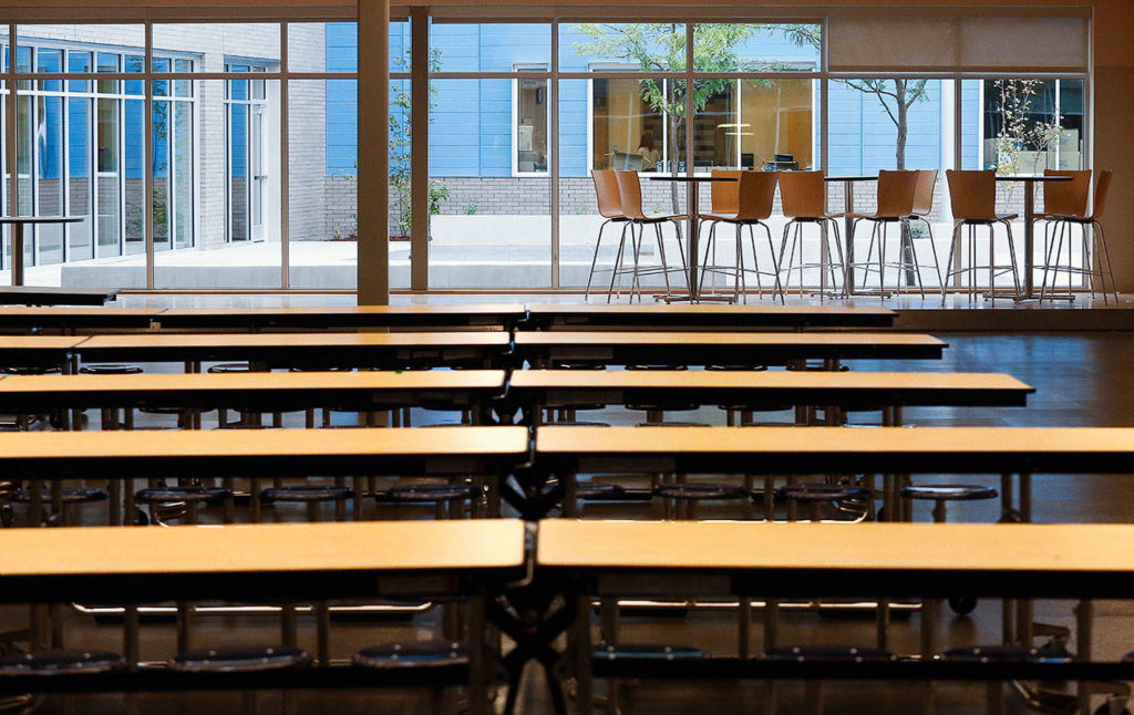 At the new North Middle School, a roomy commons and cafeteria look out on a courtyard, accessible only from inside the school’s building. (Dan Bates / The Herald)
