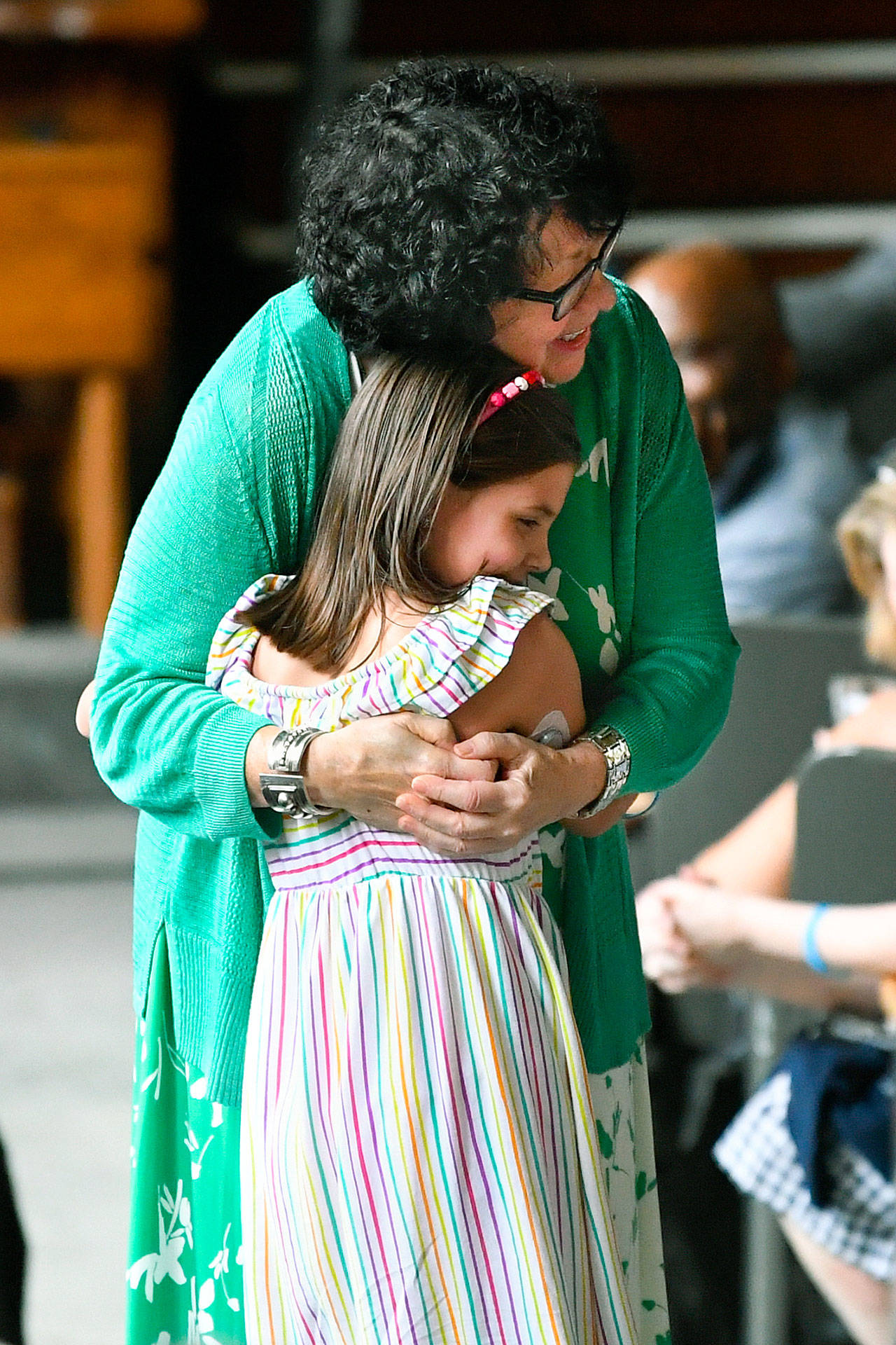 U.S. Supreme Court Justice Sonia Sotomayor hugs a child who is a fellow diabetic during an event Sunday in Decatur, Georgia, promoting her new children’s book “Just Ask!” about children with “life challenges” including diabetes. (AP Photo/John Amis)