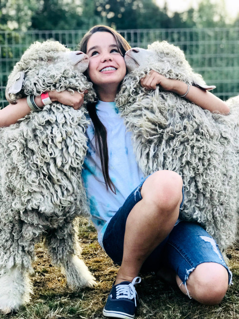 Ruthie Florey took this photo of her twin sister, Gracie, and angora goats Charlotte and Harmony on the 5-acre farm near Arlington where they live with parents Glenn and Cate Florey.
