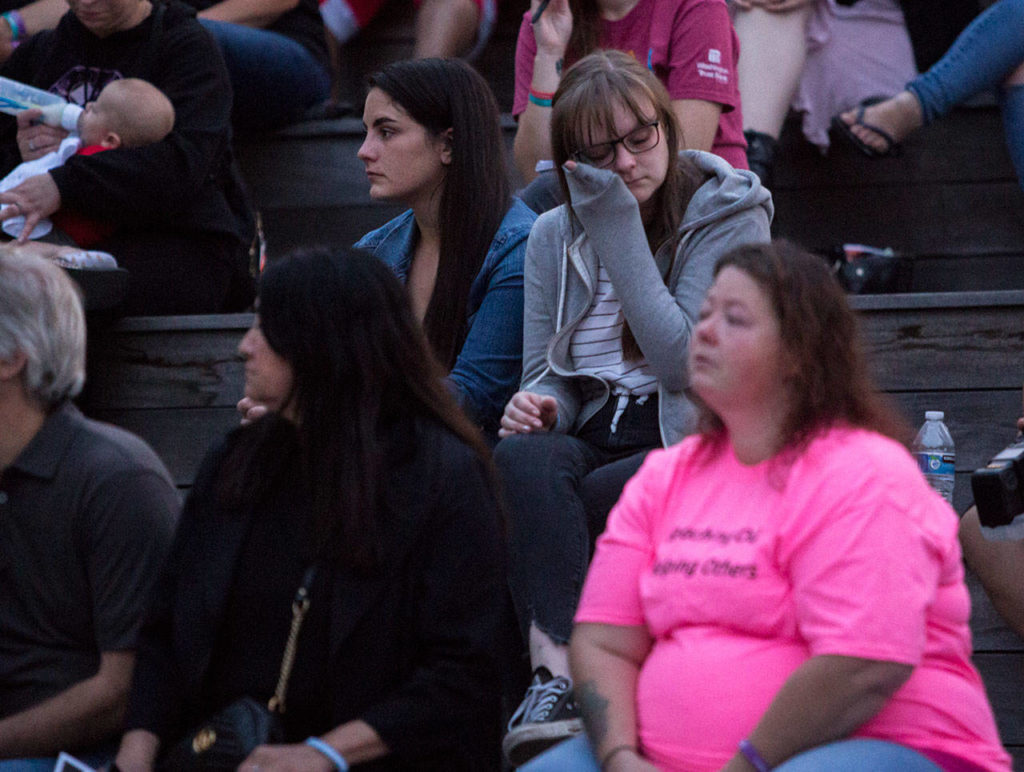 Ali Evans, a friend of Corey Lee, wipes away tears during Snohomish Overdose Prevention’s A Night to Remember on Thursday in Everett. (Olivia Vanni / The Herald)
