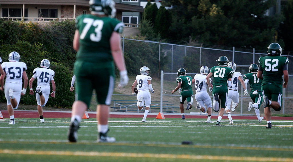 Glacier Peak’s Ryan Kinney (9) runs a blocked field goal back 70 yards for a touchdown during a game against Edmonds-Woodway on Sept. 6, 2019, at Edmonds Stadium. (Andy Bronson / The Herald)
