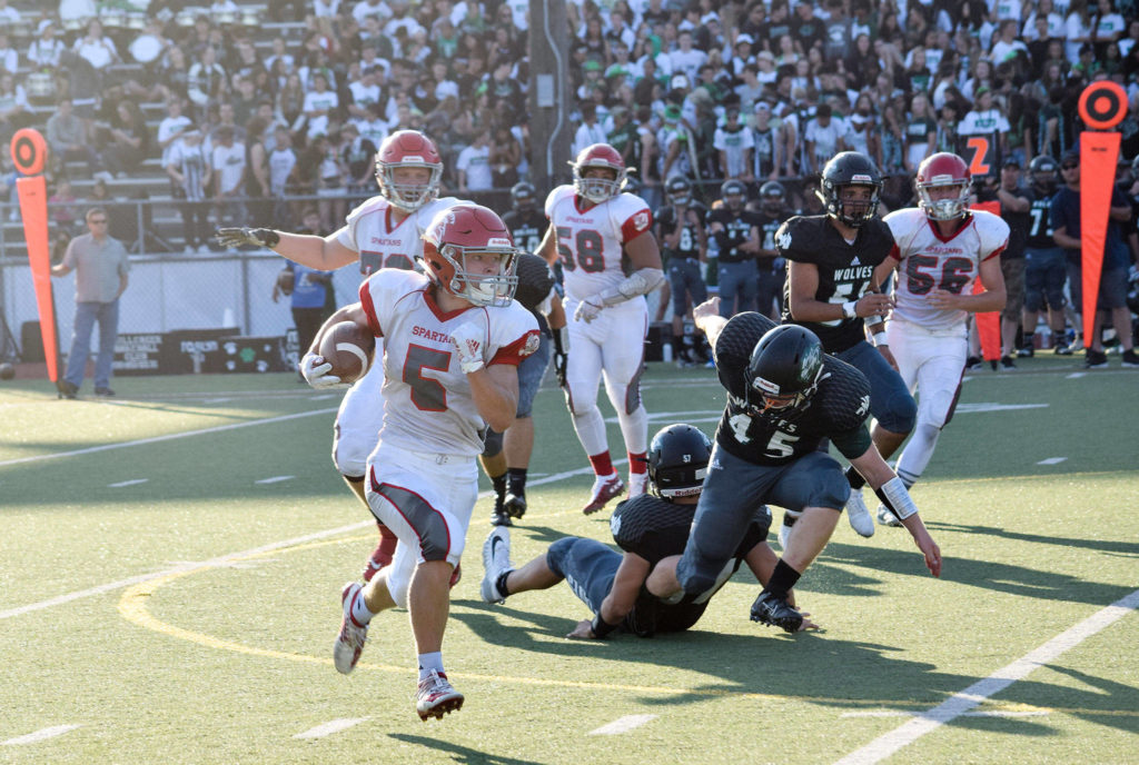 Freshman wide receiver Ryder Bumgarner runs for a first down against Jackson on Friday at Everett Memorial Stadium. (Katie Webber / The Herald)
