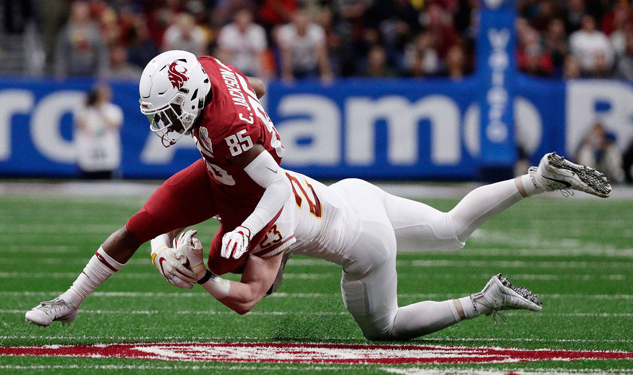 Washington State’s Calvin Jackson Jr. (85) is battling with Tay Martin and Rodrick Fisher for a starting receiver job. (AP Photo/Eric Gay)
