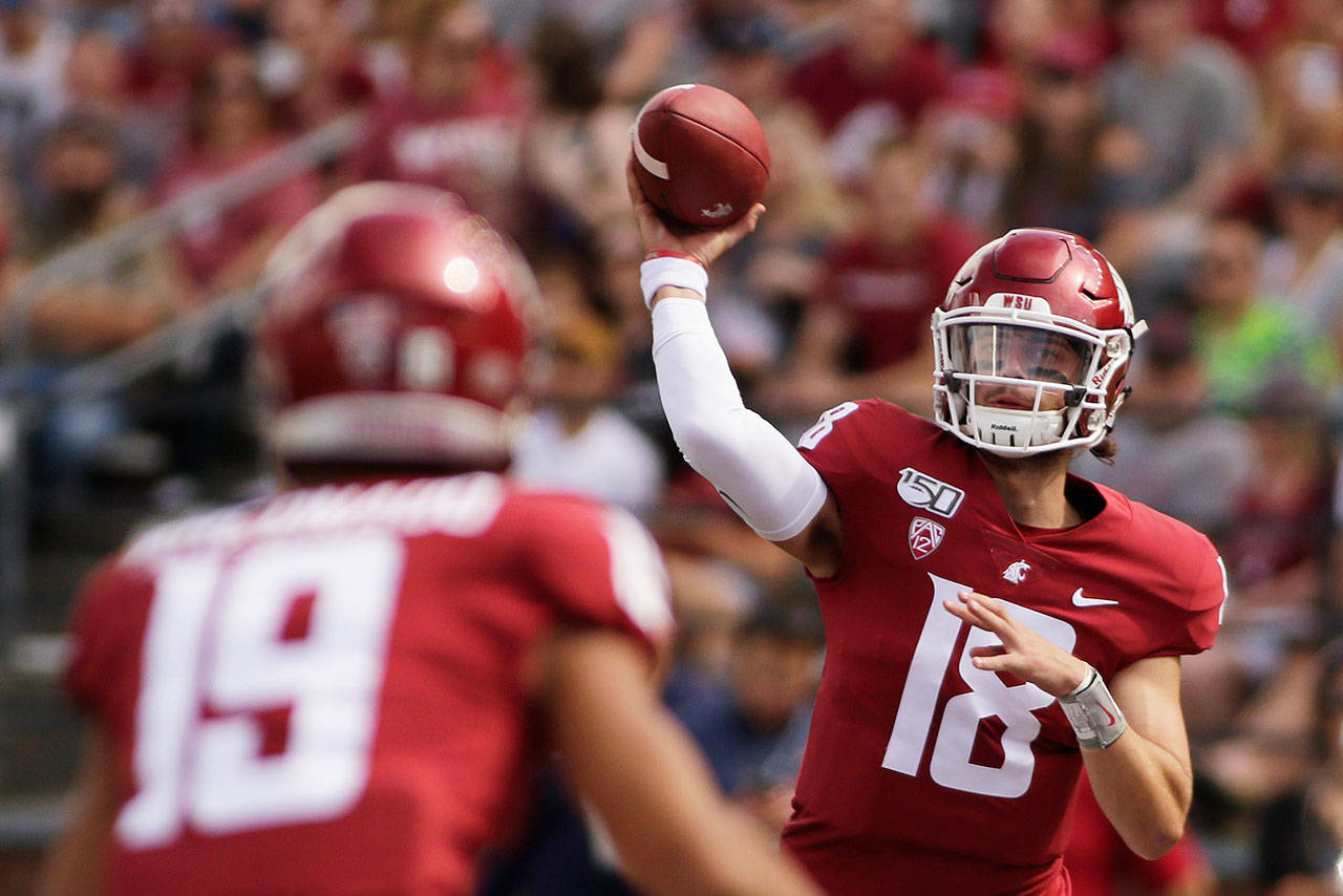Washington State quarterback Anthony Gordon (right) throws a pass to wide receiver Brandon Arconado during the first half of a game against Northern Colorado on Sept. 7, 2019, in Pullman. (AP Photo/Young Kwak)