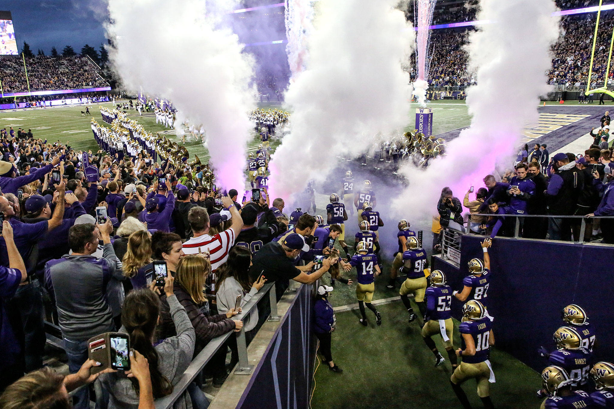 The Huskies exit the tunnel for their game against the Bears Saturday night at Husky Stadium in Seattle on September 7, 2019.(Kevin Clark / The Herald)