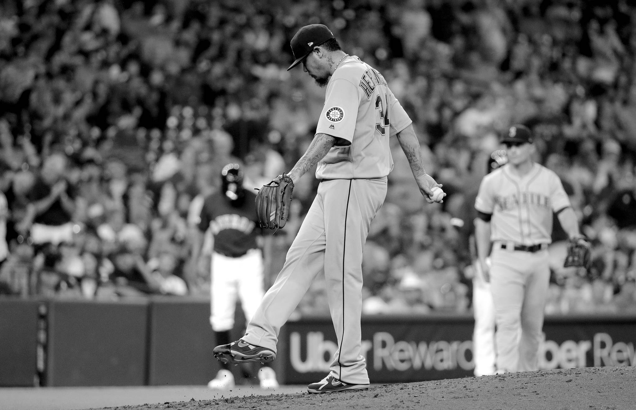 David J. Phillip / Associated Press                                Seattle Mariners starting pitcher Felix Hernandez kicks the dirt on the mound after giving up an RBI double to Houston’s Martin Maldonado during the third inning of Sunday’s game in Houston.