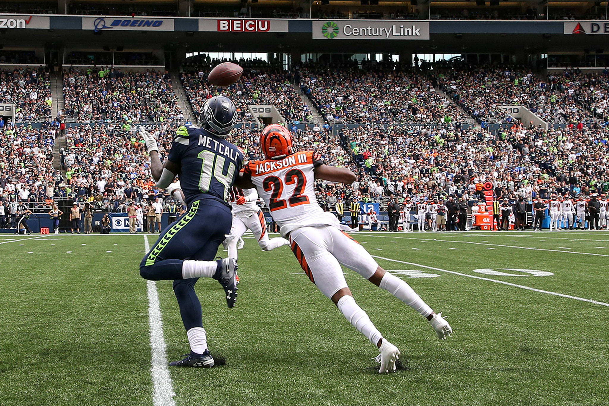 Seattle’s DK Metcalf (left) makes the catch over Cincinnati’s William Jackson III at CenturyLink Field Sunday afternoon in Seattle on September 8, 2019.(Kevin Clark / The Herald)