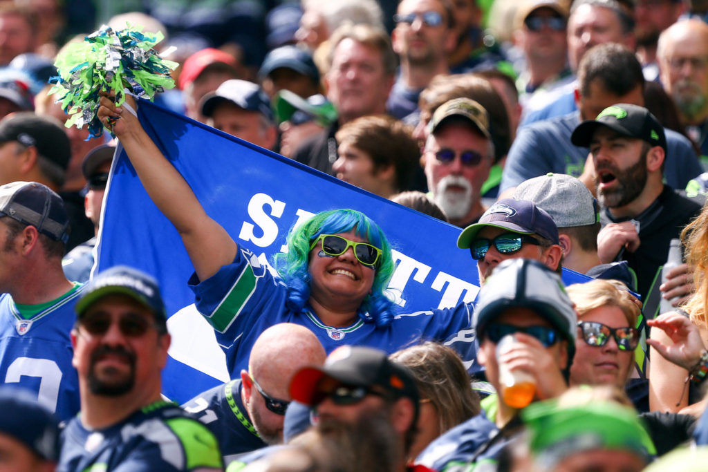 A 12 showing off her spirit at CenturyLink Field Sunday afternoon in Seattle on September 8, 2019.(Kevin Clark / The Herald)
