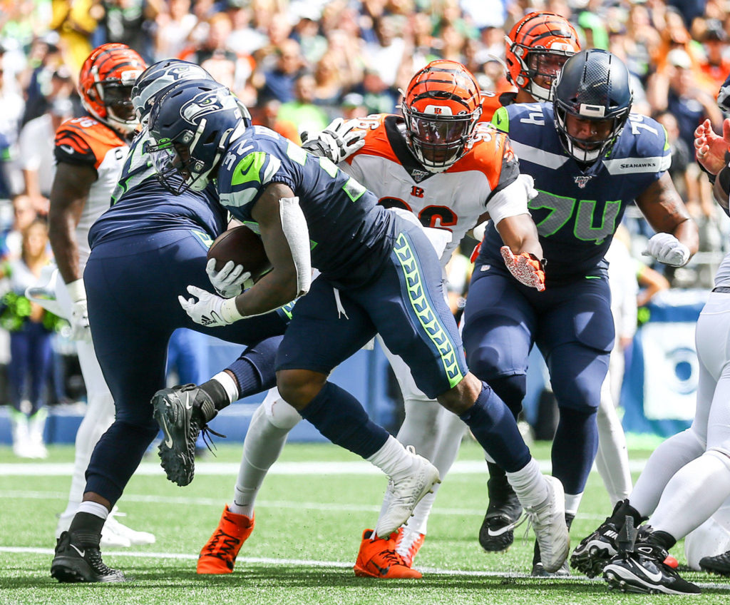 Seattle’s Chris Carson scores first of his two touchdowns of the first half at CenturyLink Field Sunday afternoon in Seattle on September 8, 2019.(Kevin Clark / The Herald)
