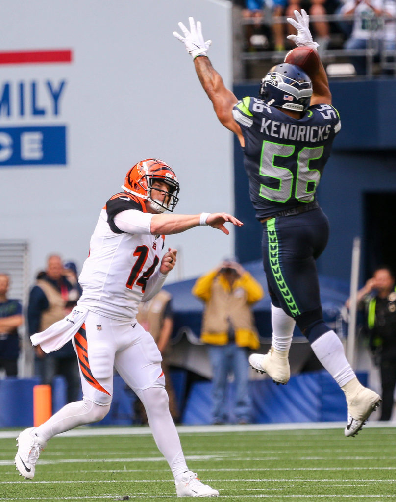 Seattle’s Mychal Kendricks deflects a pass attempt by Cincinnati’s Andy Dalton at CenturyLink Field Sunday afternoon in Seattle on September 8, 2019. The Seahawks won 21-20. (Kevin Clark / The Herald)
