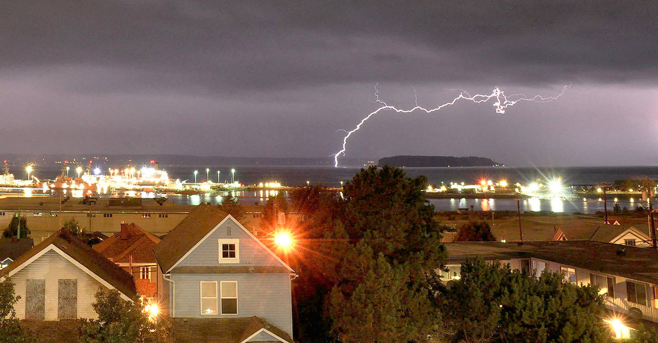 A lightning strike seen from Rucker Avenue in Everett on Saturday night. The National Weather Service counted more than 2,200 cloud-to-ground strikes between 6 and 11 p.m. (Sue Misao / The Herald)