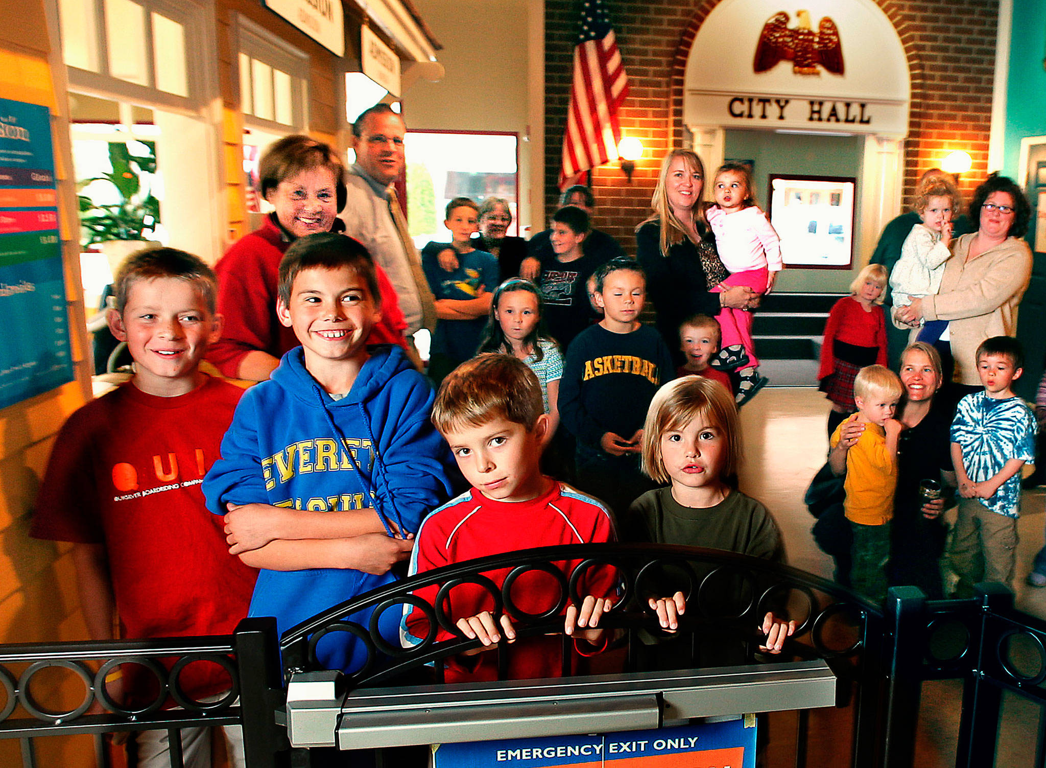 Myrna Overstreet, a force behind the founding of the Imagine Children’s Museum, is shown here with some of her grandchildren and other kids at the museum’s 2004 opening. From left are Billy Burton, Matt Overstreet, Jake Burton and Caroline Overstreet, with their proud grandma behind Matt. Myrna Overstreet, 82, died Aug. 19. (Dan Bates / Herald file)