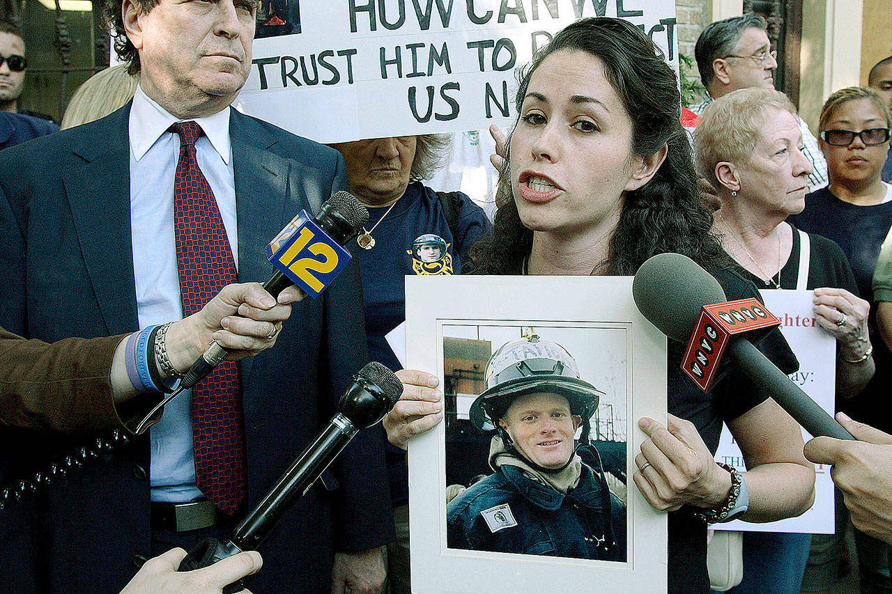 Rosaleen Tallon, who lost her brother Sean Tallon of FDNY Ladder 10 during the 911 attacks speaks to reporters Brooklyn borough of New York on May 29, 2007. Sept. 11 victims’ relatives are greeting the news of President Donald Trump’s now-canceled plan for secret talks with Afghanistan’s Taliban insurgents with mixed feelings. Tallon says she wants U.S. troops home and wants the country to focus on getting answers from Saudi Arabia about 9/11. (AP Photo/Adam Rountree, File)