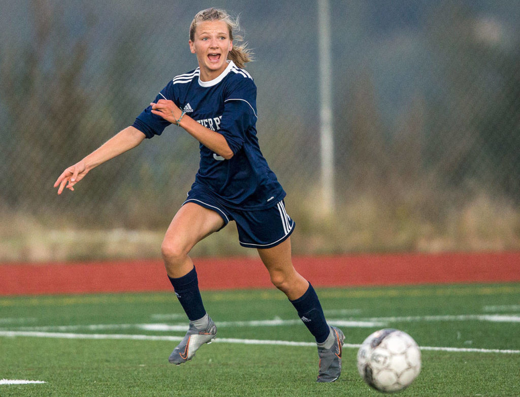 Glacier Peak’s Chloe Seelhoff points to where she wants the ball played during a non-conference girls soccer game Tuesday at Glacier Peak High School in Snohomish. (Olivia Vanni / The Herald)
