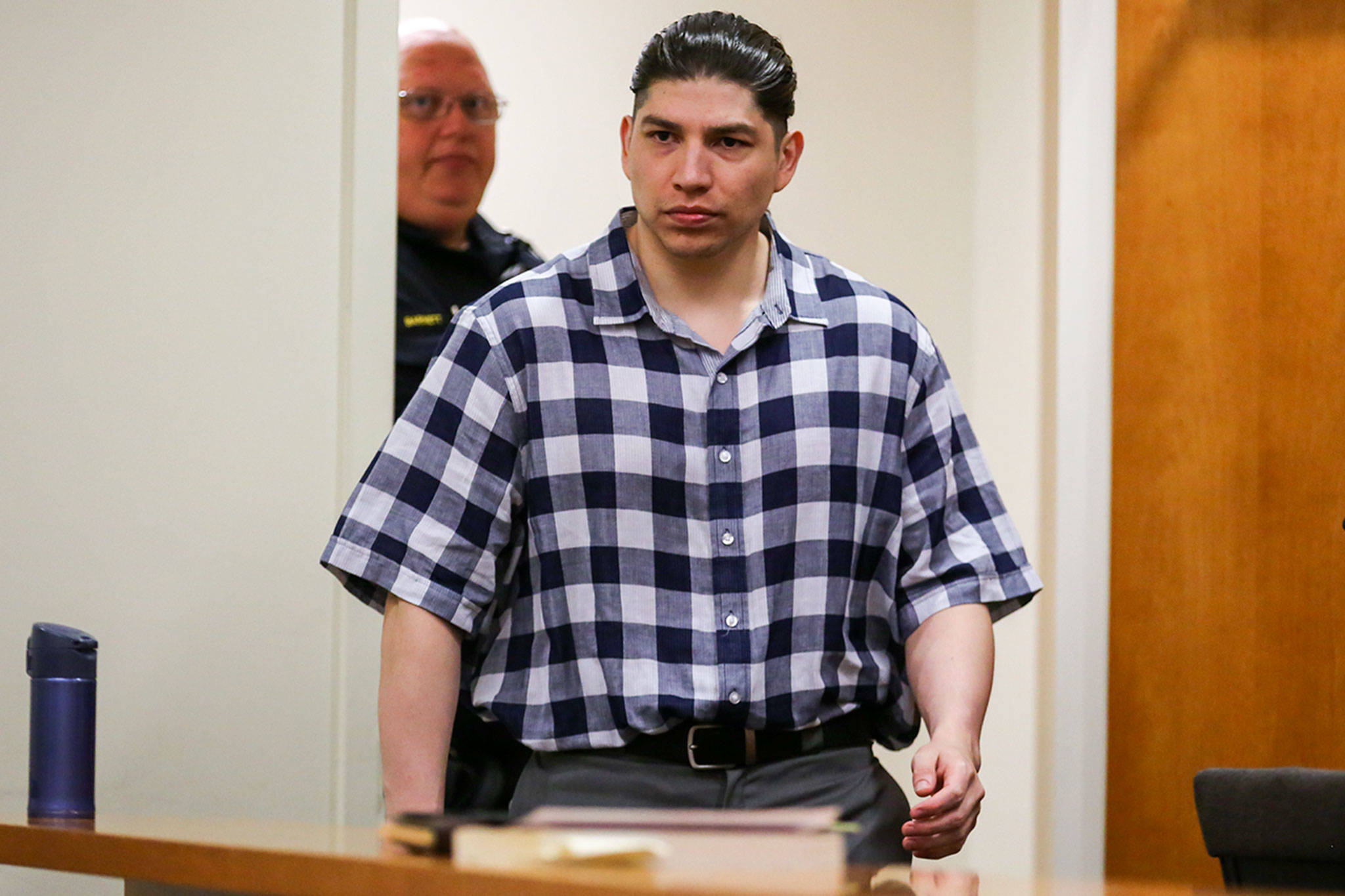 Encarnacion Salas enters the courtroom to start his retrial Wednesday morning at Snohomish County Courthouse. (Kevin Clark / The Herald)