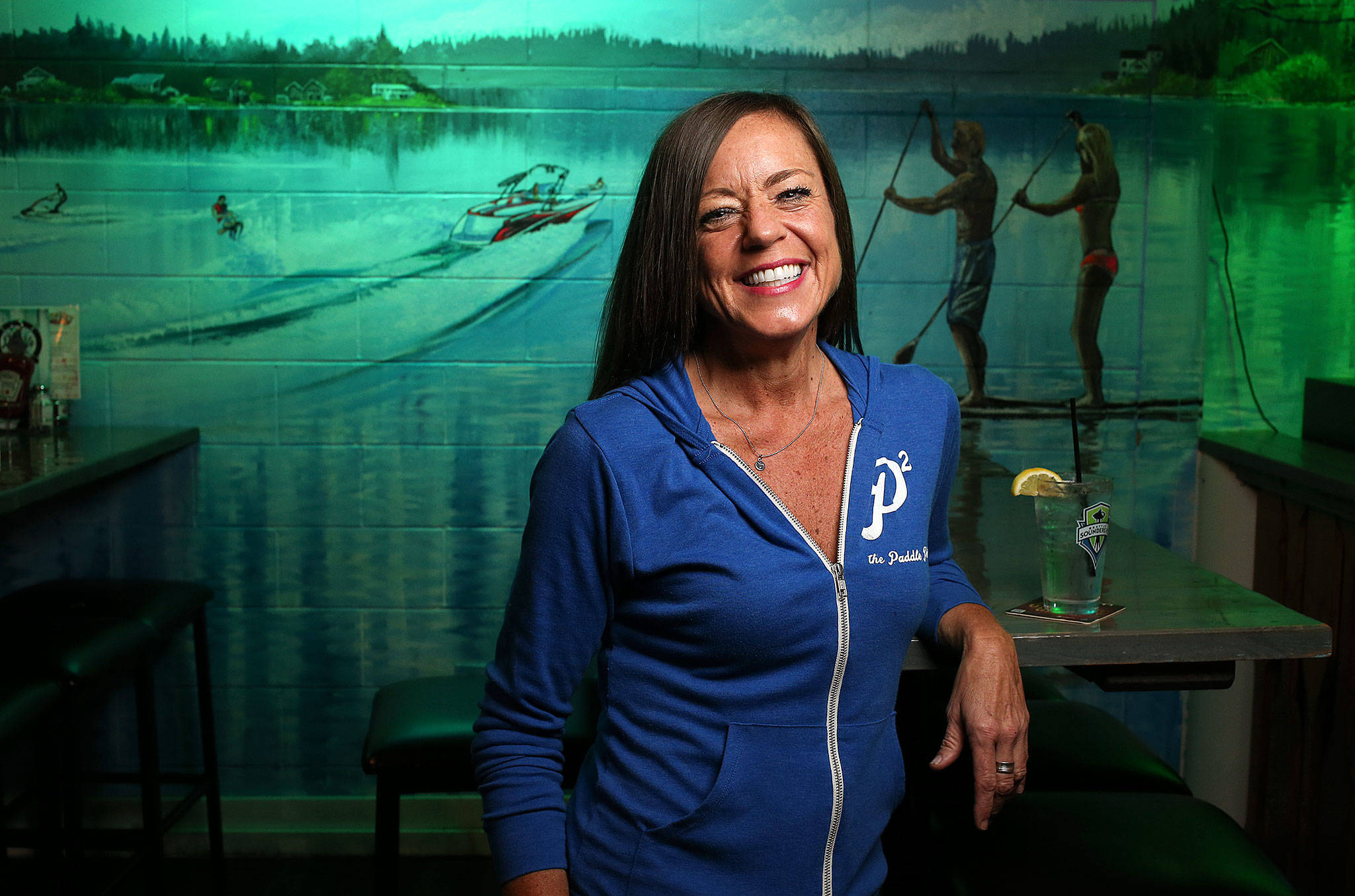 Deanna VanderVate, 48, is a bartender at The Paddle Pub in Stanwood. She calls it her second home. (Andy Bronson / The Herald)