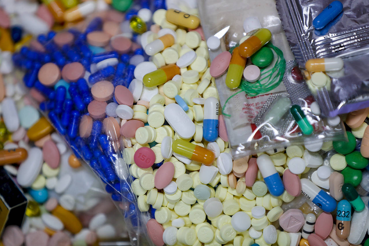 Medications that are are stored in the police headquarters that are and slated for destruction are shown in a locked storage area Wednesday in Barberton, Ohio. Attorneys representing some 2,000 local governments said Wednesday they have agreed to a tentative settlement with OxyContin maker Purdue Pharma over the toll of the nation’s opioid crisis. (AP Photo/Keith Srakocic)